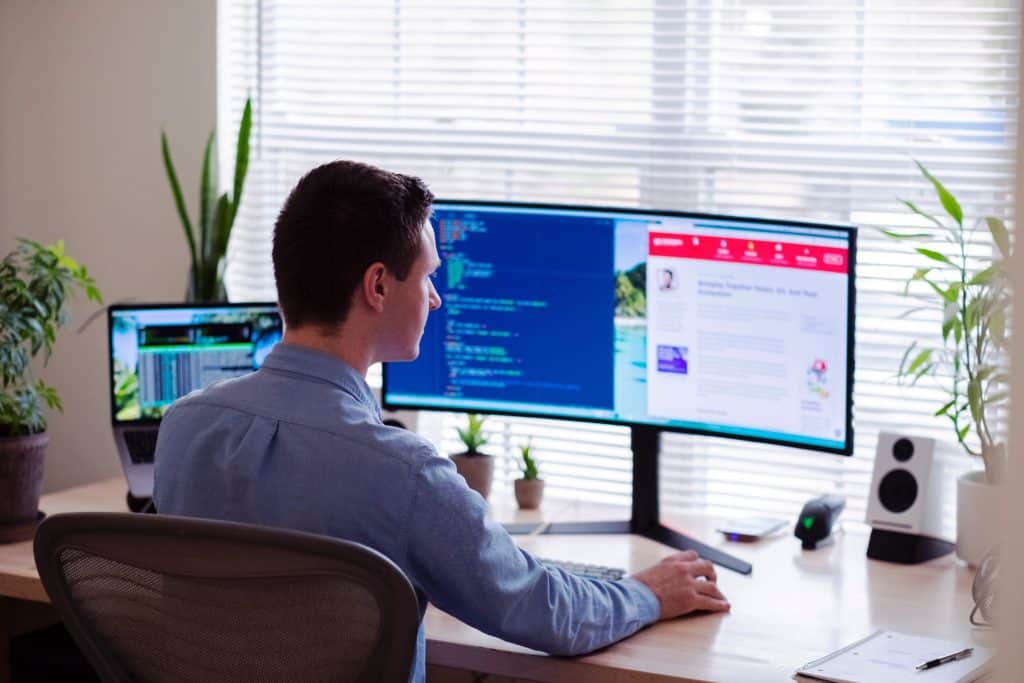 a man looking at his monitor